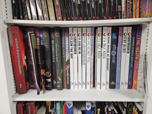 Monte Cook Games shelf of our TTRPG bookshelf