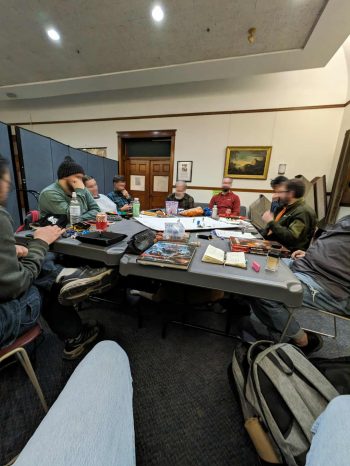 photo of players one very very busy day at Dave's library game